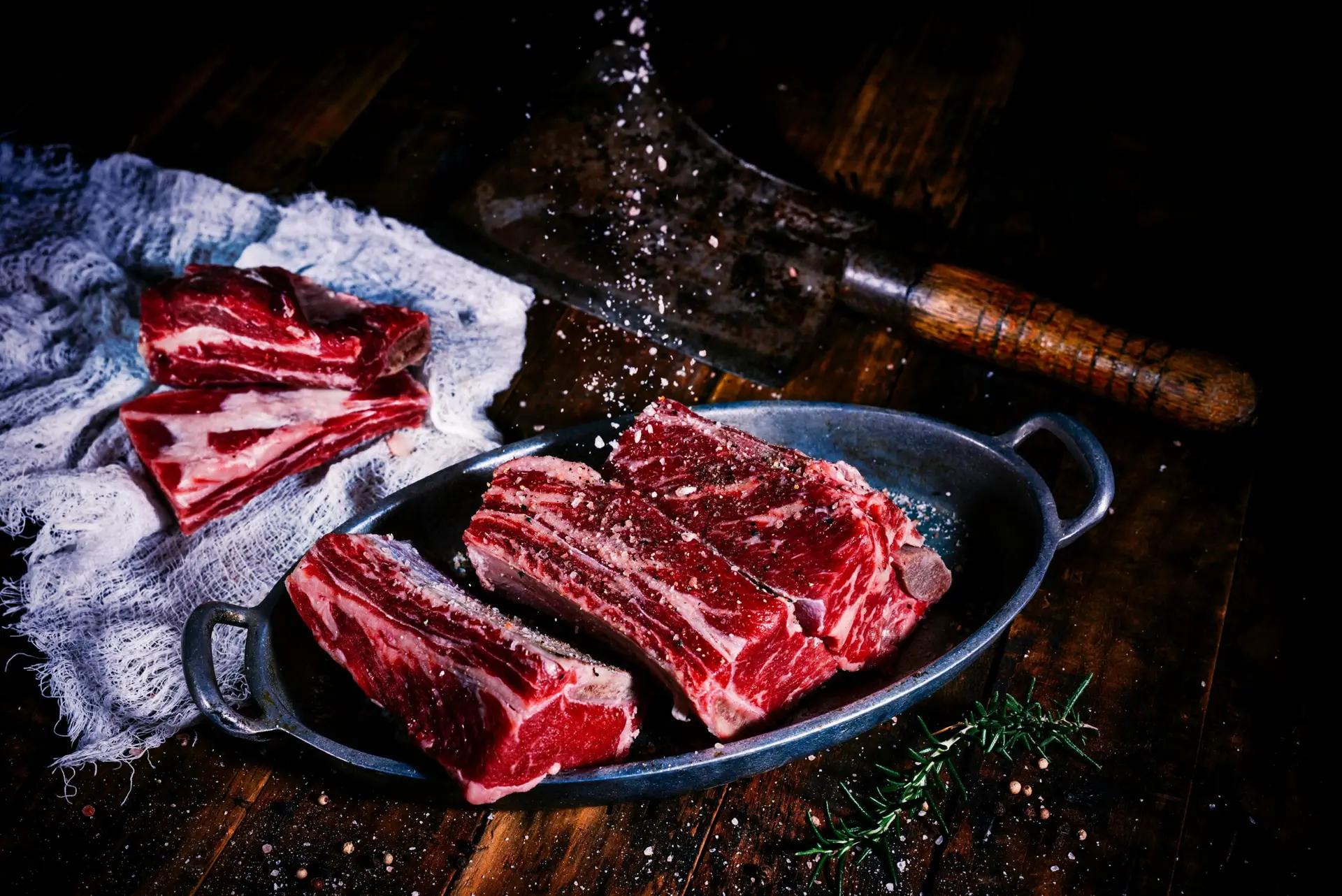 sliced meat on black wooden table